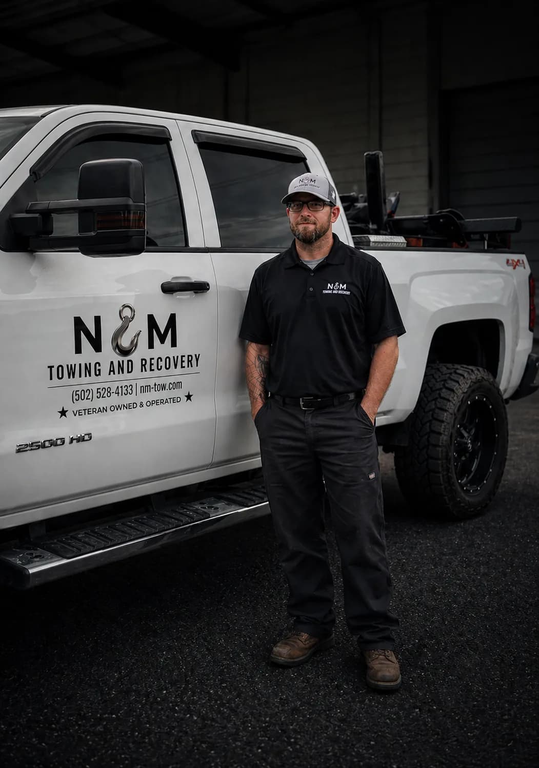 Nicholas Clements with N&M truck on active job site